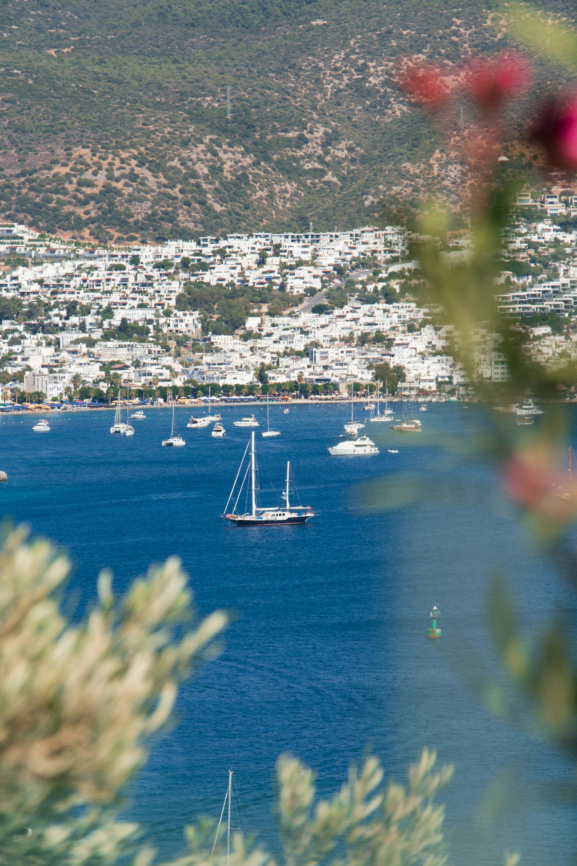 Bodrum bay with sailing yachts at anchor and the whitewashed town on the hillside